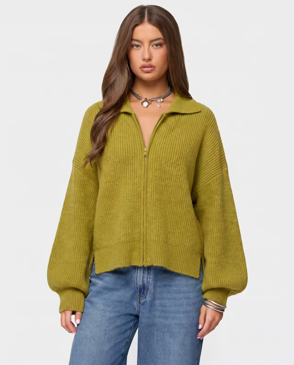 STYLEBURY Zip Knit Cardigan in pistachio color, featuring a front zipper and cozy knit texture, displayed on a hanger.