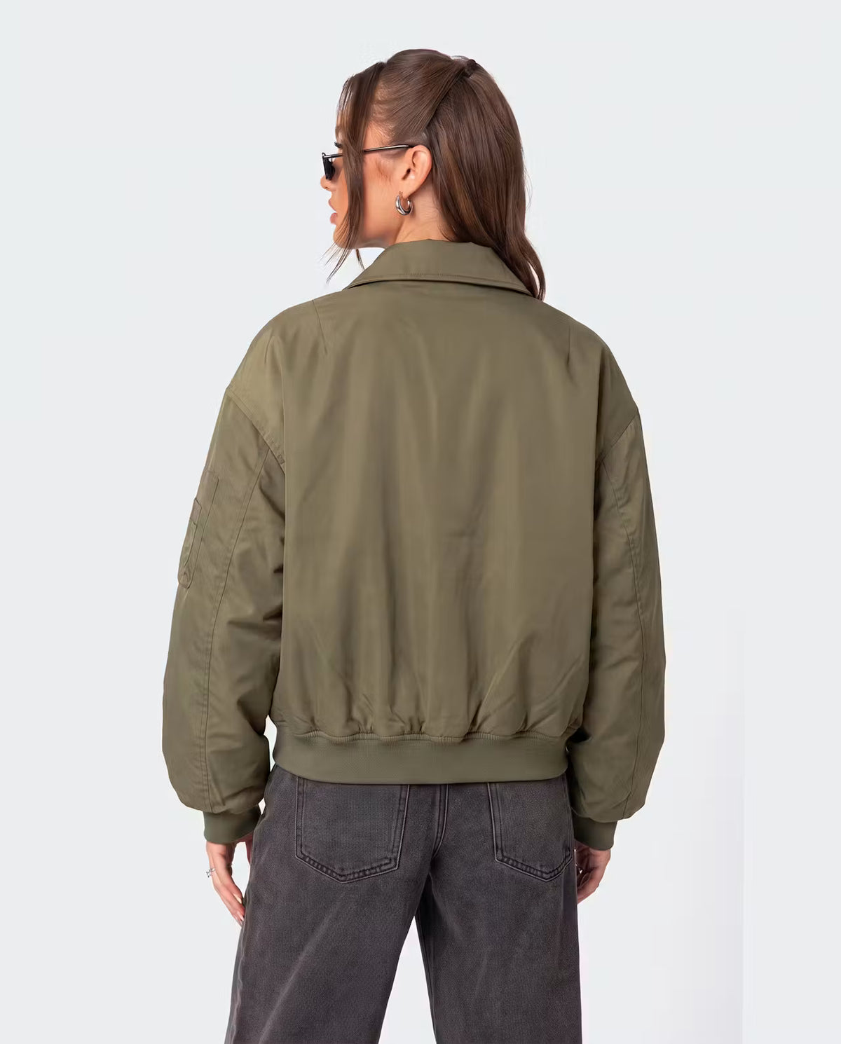 STYLEBURY Capsule Bomber Khaki jacket with ribbed cuffs and collar, lightweight design, shown on a hanger against a neutral background.
