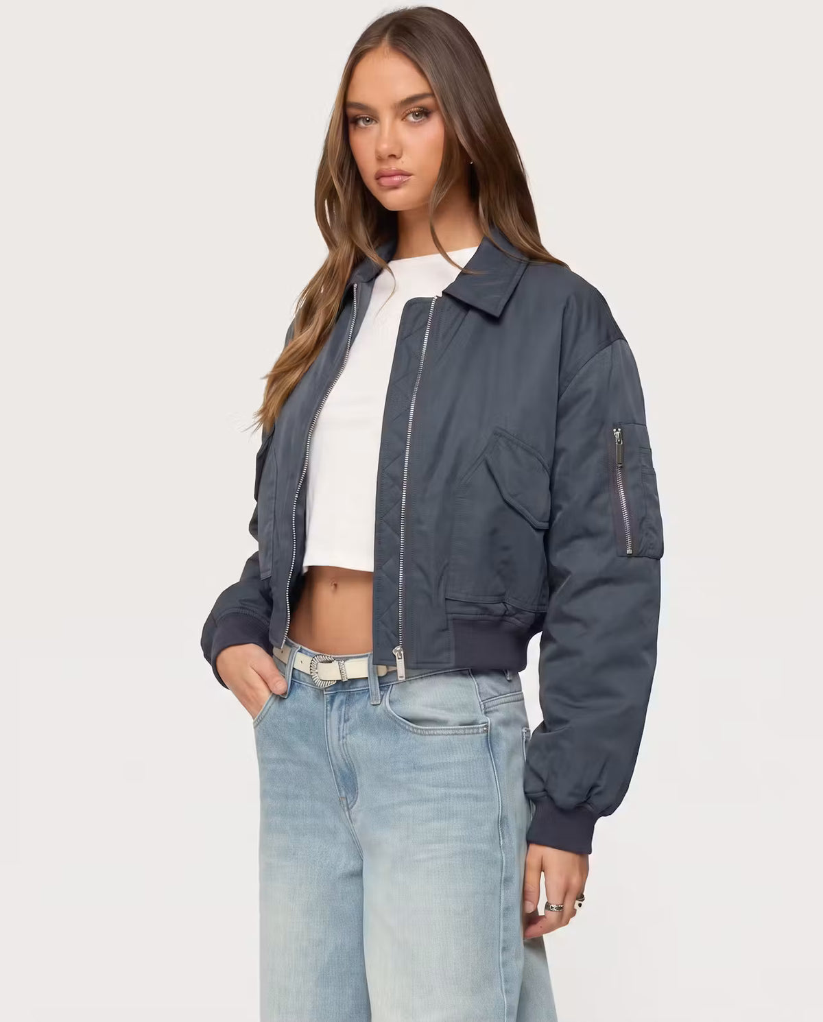STYLEBURY Capsule Bomber Charcoal jacket with quilted design and ribbed cuffs, displayed on a hanger.