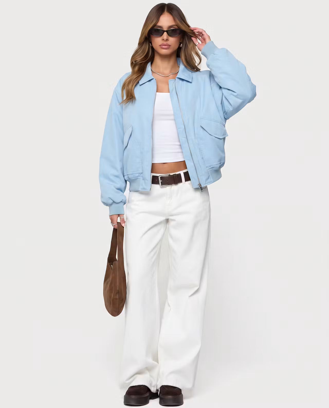 Baby blue Capsule Bomber jacket by STYLEBURY featuring a sleek, padded design and a ribbed collar and cuffs.