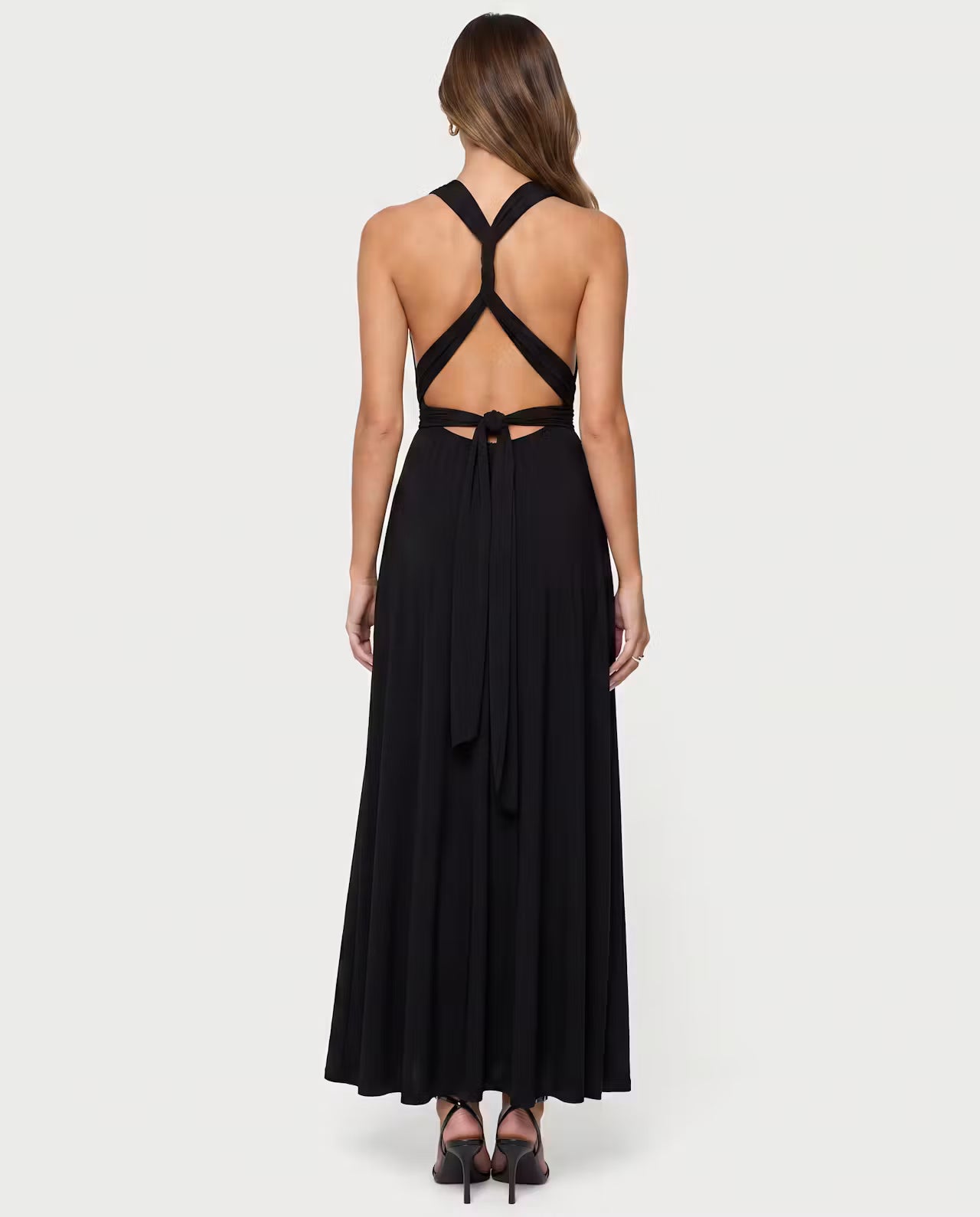 Black Twisted Maxi Dress by STYLEBURY featuring a flowing silhouette and elegant design, shown on a model.