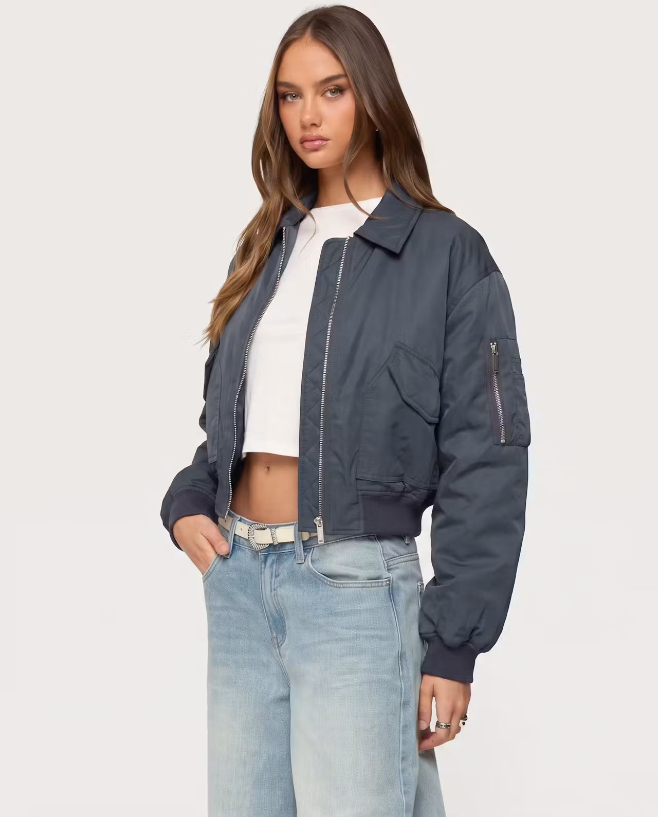 STYLEBURY Capsule Bomber Charcoal jacket with quilted design and ribbed cuffs, displayed on a hanger.